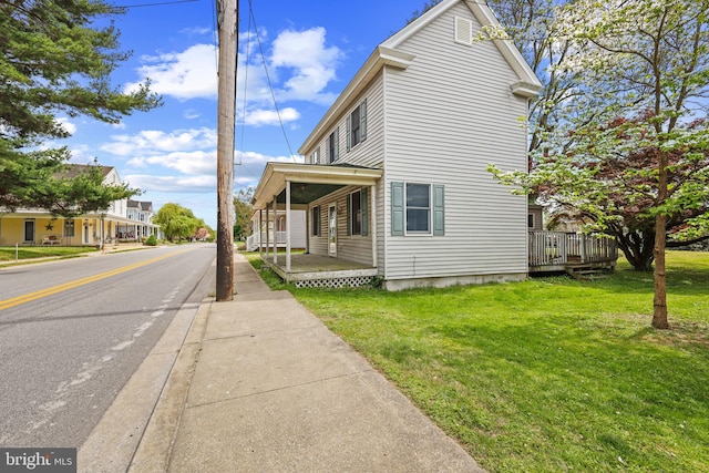 112 Walnut St, Church Hill, MD 21623 - view of side of property with covered porch and a yard