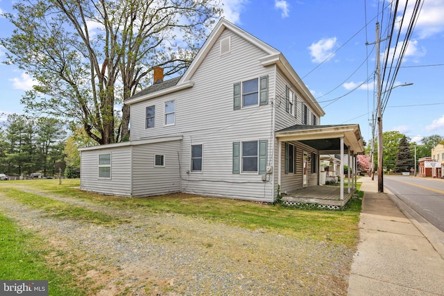 112 Walnut St, Church Hill, MD 21623 - view of side of home featuring a yard and a chimney