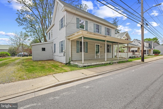 112 Walnut St, Church Hill, MD 21623 - view of front facade with covered porch and a front lawn