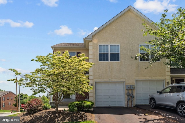 1100 Balley Dr Unit 4, Phoenixville, PA 19460 - view of property with driveway, a garage, and stucco siding