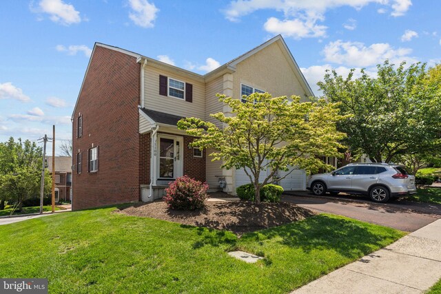 1100 Balley Dr Unit 4, Phoenixville, PA 19460 - view of front of house with a front yard, brick siding, and driveway