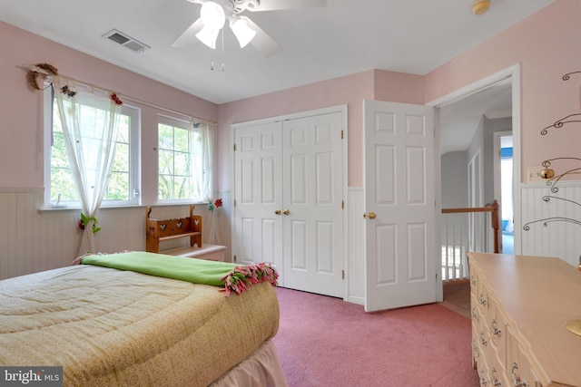 11294 Country Club Rd, New Market, MD 21774 - bedroom with light carpet, a closet, a wainscoted wall, and ceiling fan