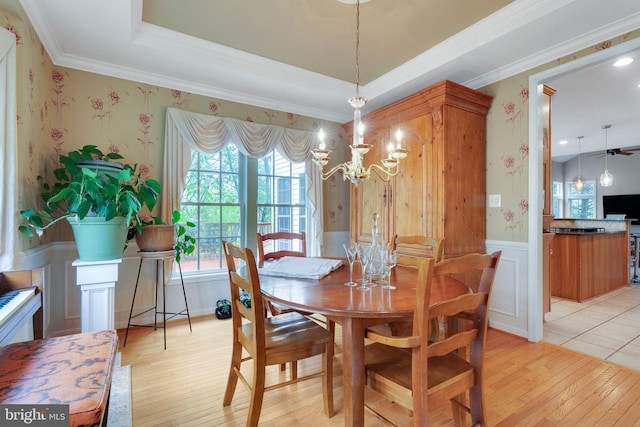 11294 Country Club Rd, New Market, MD 21774 - dining area with light wood-style floors, a wainscoted wall, ornamental molding, a chandelier, and wallpapered walls