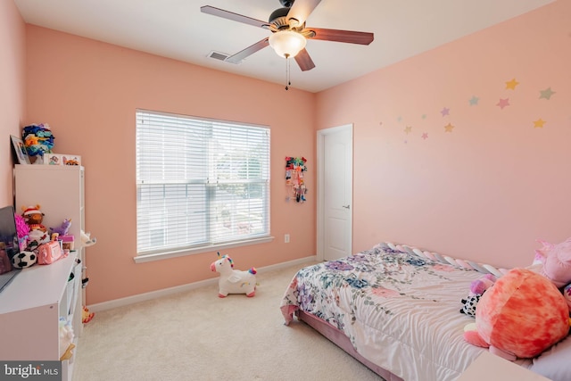bedroom featuring carpet floors, a ceiling fan, baseboards, and visible vents
