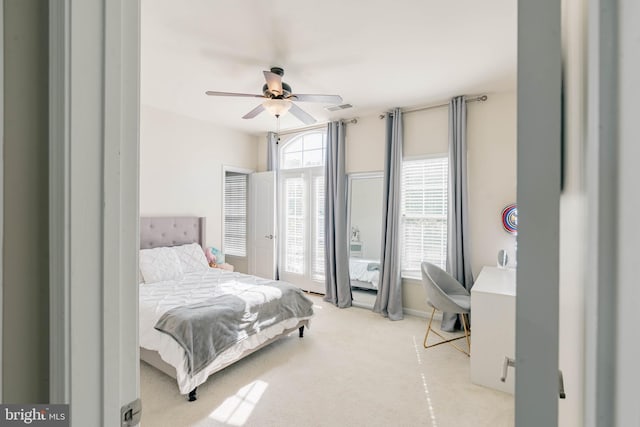 bedroom with a ceiling fan, visible vents, and carpet