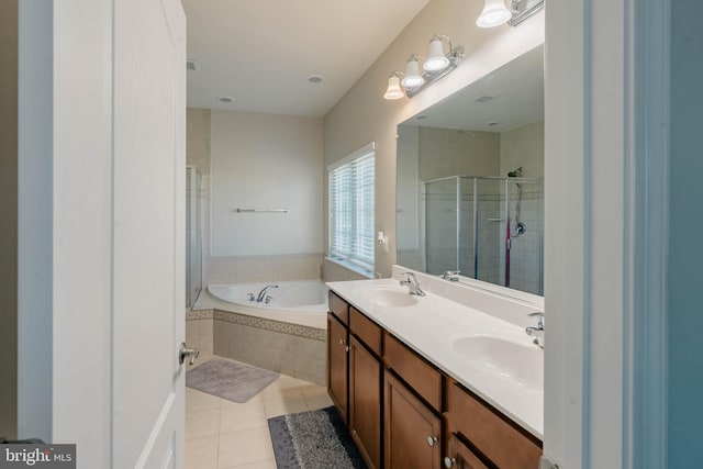 full bathroom with a sink, a bath, a stall shower, and tile patterned floors