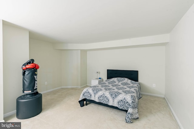 bedroom with baseboards and carpet flooring