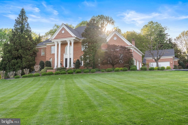 2619 Sledding Hill Rd, Oakton, VA 22124 - neoclassical / greek revival house featuring brick siding and a front lawn