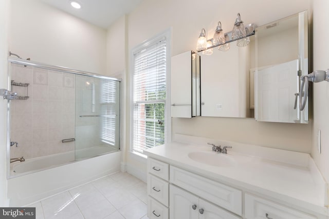 2619 Sledding Hill Rd, Oakton, VA 22124 - full bath featuring tile patterned floors, bath / shower combo with glass door, and vanity