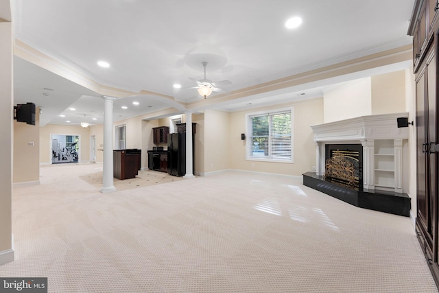 2619 Sledding Hill Rd, Oakton, VA 22124 - unfurnished living room with a fireplace with raised hearth, a ceiling fan, baseboards, ornate columns, and ornamental molding
