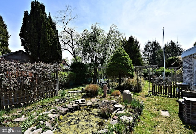 view of yard featuring fence
