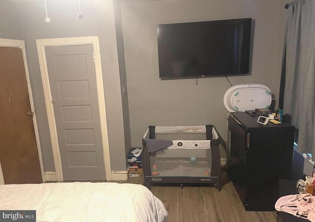 bedroom with wood finished floors