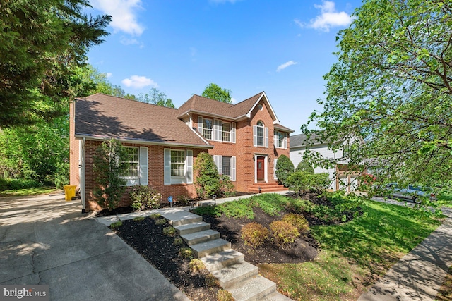traditional home featuring brick siding