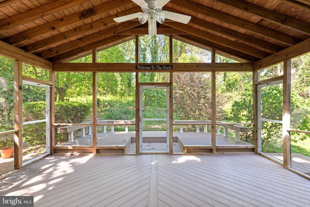 unfurnished sunroom with a ceiling fan