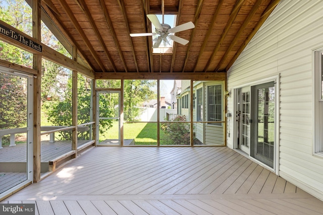 unfurnished sunroom with ceiling fan