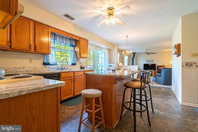 1069 E 2nd St, Red Hill, PA 18076 - kitchen with visible vents, a center island, a sink, ceiling fan with notable chandelier, and open floor plan
