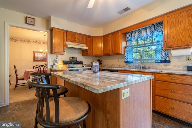 1069 E 2nd St, Red Hill, PA 18076 - kitchen featuring visible vents, brown cabinets, black range with electric stovetop, a sink, and under cabinet range hood