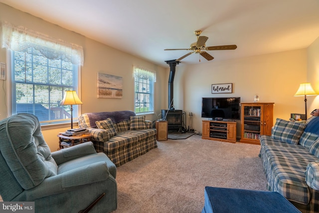 1069 E 2nd St, Red Hill, PA 18076 - living room featuring ceiling fan, light colored carpet, and a wood stove