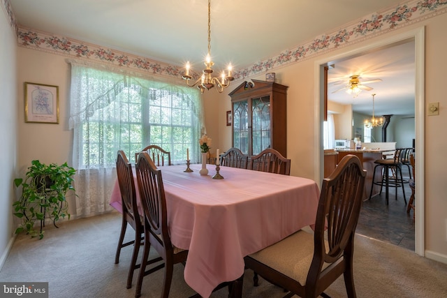 1069 E 2nd St, Red Hill, PA 18076 - carpeted dining area with baseboards and a notable chandelier