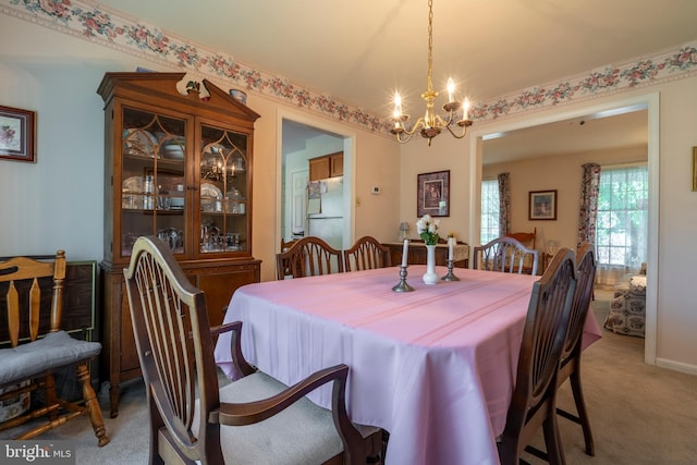 1069 E 2nd St, Red Hill, PA 18076 - dining space with light colored carpet and a notable chandelier