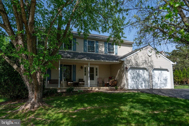 1069 E 2nd St, Red Hill, PA 18076 - traditional-style home with an attached garage, a front lawn, covered porch, and driveway
