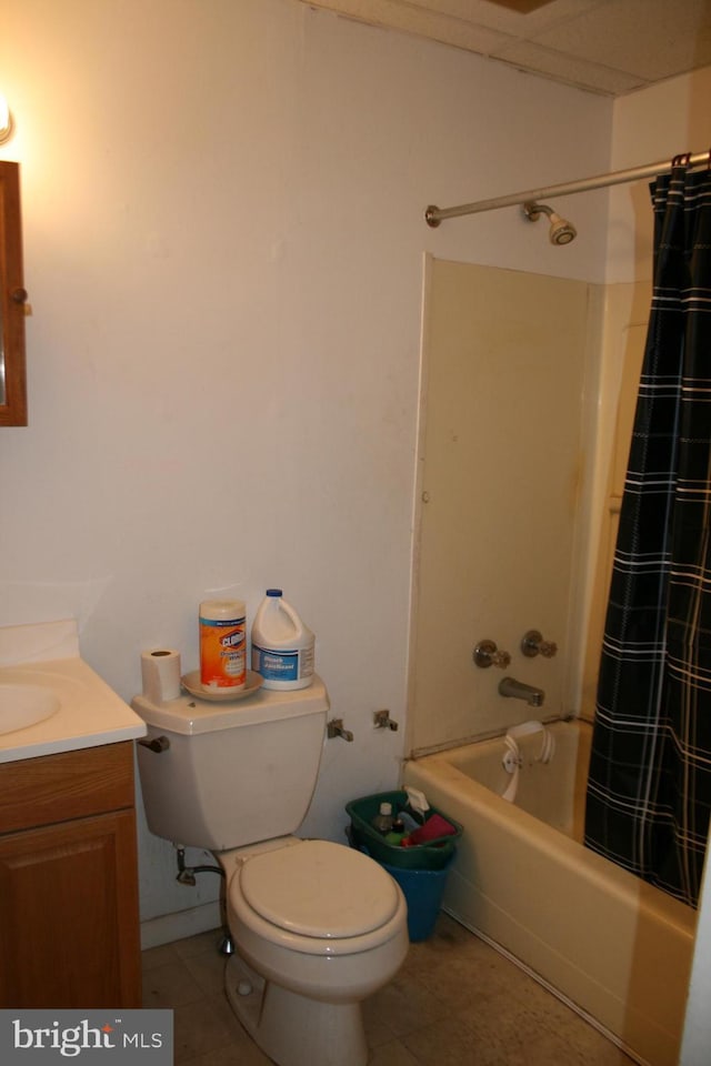 bathroom featuring shower / bath combination with curtain, toilet, tile patterned flooring, and vanity
