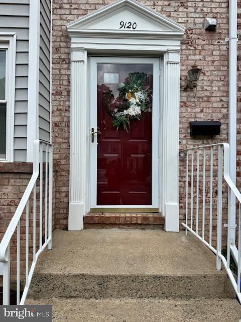 9120 Galbreth Ct, Springfield, VA 22153 - doorway to property with brick siding