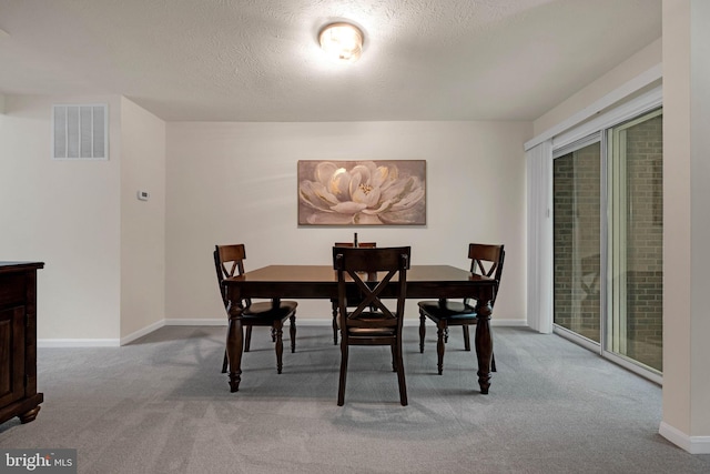 9120 Galbreth Ct, Springfield, VA 22153 - dining space featuring carpet flooring, baseboards, a textured ceiling, and healthy amount of natural light