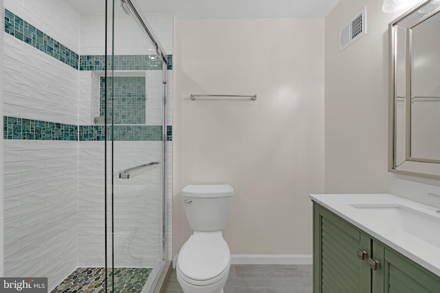 9120 Galbreth Ct, Springfield, VA 22153 - bathroom featuring a stall shower, toilet, vanity, and baseboards