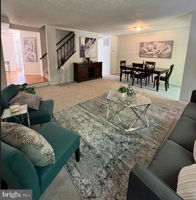 9120 Galbreth Ct, Springfield, VA 22153 - living room featuring carpet, stairs, and a textured ceiling