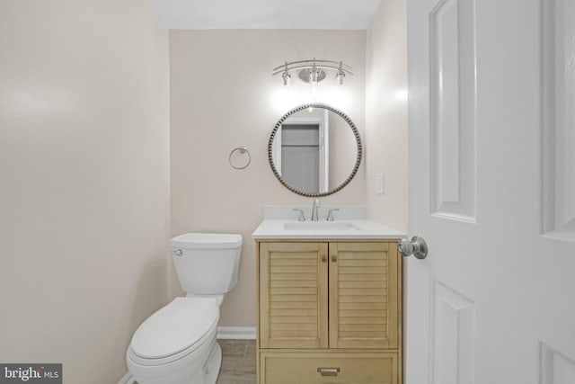 9120 Galbreth Ct, Springfield, VA 22153 - bathroom with toilet, vanity, and baseboards