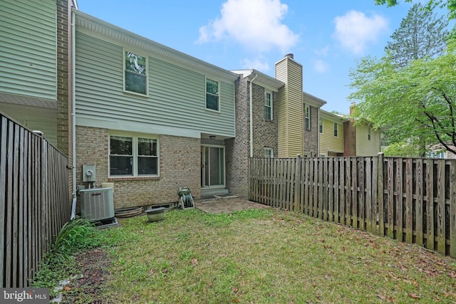 9120 Galbreth Ct, Springfield, VA 22153 - rear view of property featuring cooling unit and a chimney