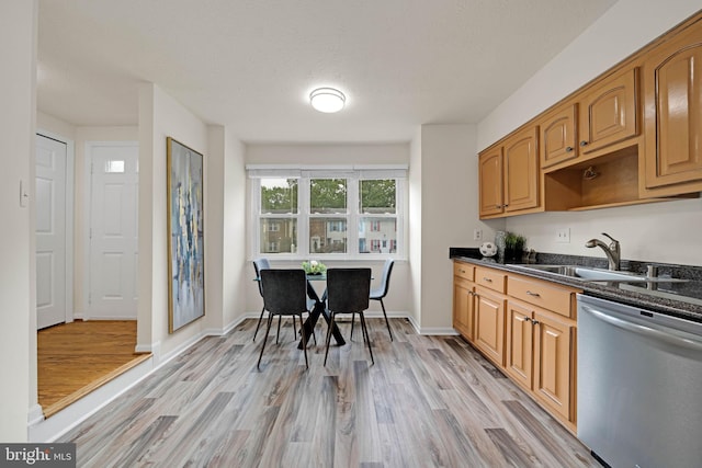 9120 Galbreth Ct, Springfield, VA 22153 - kitchen with stainless steel dishwasher, a sink, light wood-type flooring, and baseboards