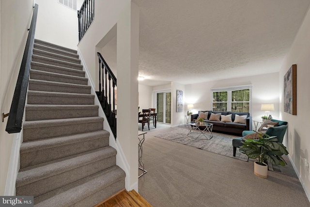 9120 Galbreth Ct, Springfield, VA 22153 - stairs with baseboards, carpet, and a textured ceiling