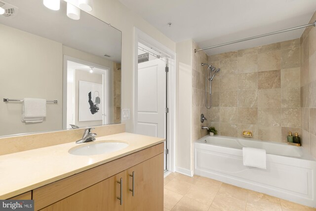 bathroom featuring tile patterned floors, visible vents, bathing tub / shower combination, and vanity