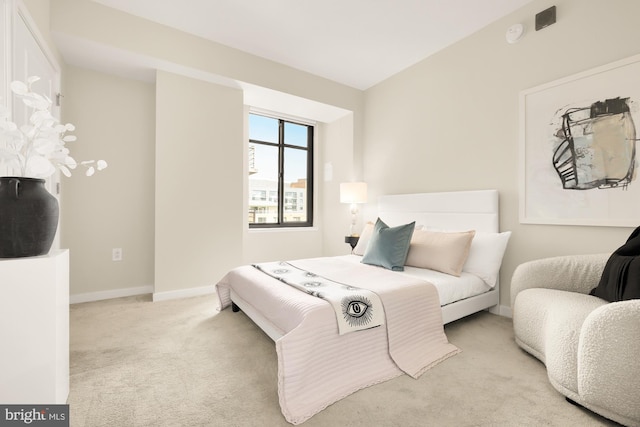 carpeted bedroom with baseboards