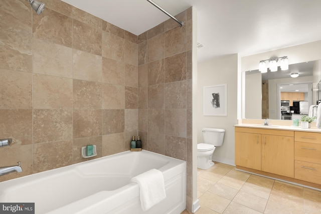 bathroom with a bathing tub, a shower, toilet, vanity, and tile patterned flooring