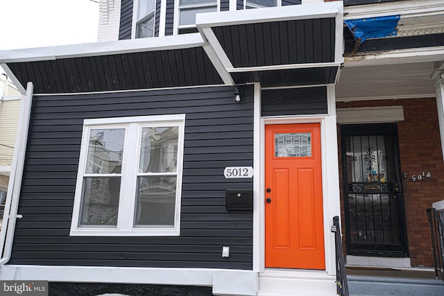 entrance to property with brick siding