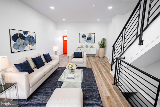 living room with stairway, wood finished floors, recessed lighting, and baseboards