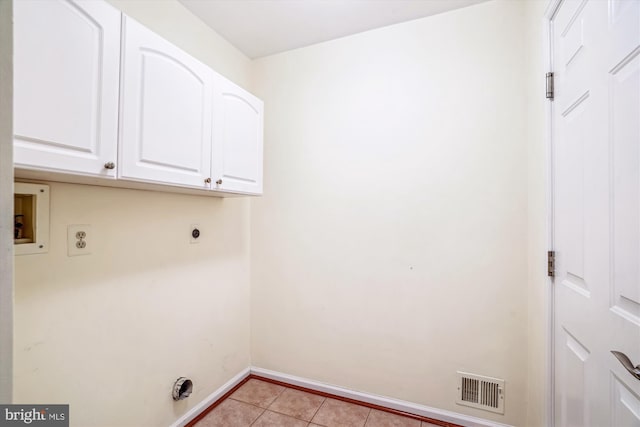 laundry room with hookup for an electric dryer, hookup for a washing machine, cabinet space, baseboards, and light tile patterned floors