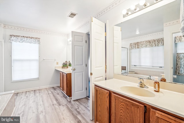 full bath with wood finished floors and vanity