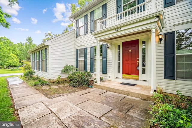 entrance to property with a balcony