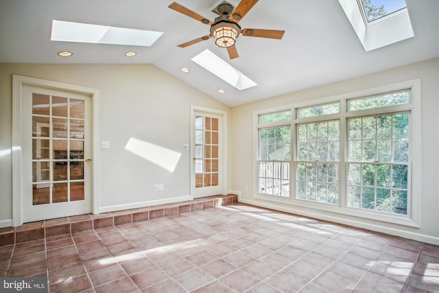 unfurnished room with recessed lighting, tile patterned floors, and vaulted ceiling with skylight