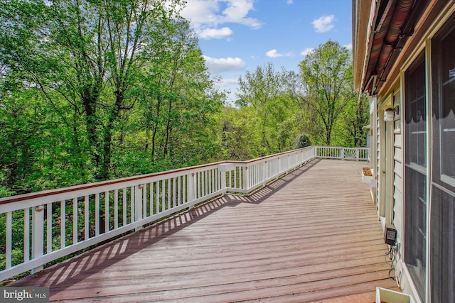 deck featuring a wooded view