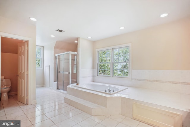 full bathroom featuring visible vents, tile patterned flooring, toilet, a bath, and a stall shower