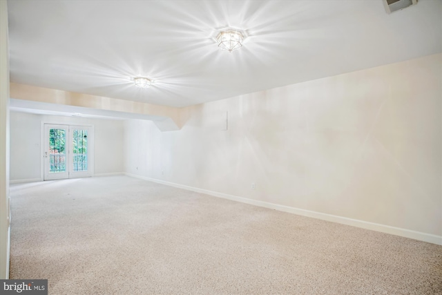 empty room featuring baseboards and visible vents