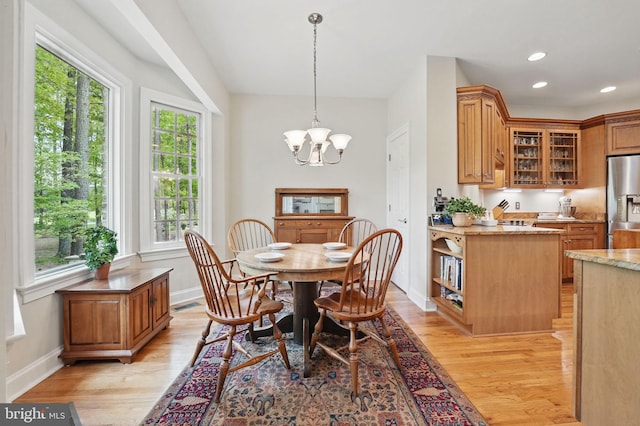 dining space with a notable chandelier, light wood-style flooring, recessed lighting, baseboards, and visible vents