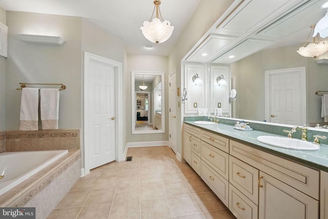 full bathroom with ensuite bathroom, a sink, tile patterned flooring, and double vanity