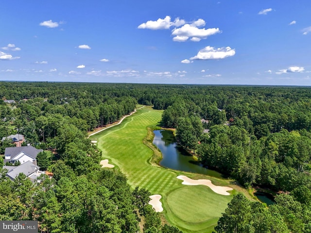 birds eye view of property with a water view, a view of trees, and view of golf course