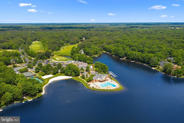 aerial view featuring a forest view and a water view
